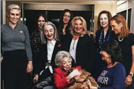  ?? DANIELLE SCRUGGS/THE NEW YORK TIMES ?? Noel Mor (from left), Laurie Mertz, Susan Good, Danielle Ward, Colette Green, Kay Torshen, Betty Bronner, Maria Pappas and Elaine Lang pause at a gathering at Good’s apartment in Chicago.