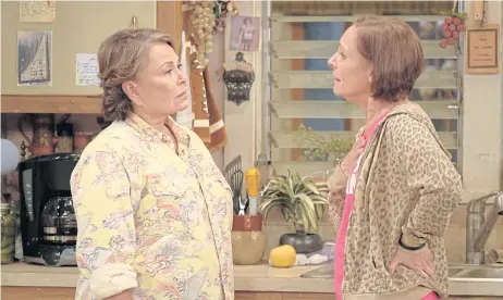  ??  ?? Roseanne Barr, left, and Laurie Metcalf appear in a scene from the reboot of the popular comedy series Roseanne.