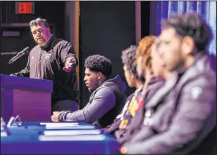  ?? L.E. Baskow
Las Vegas Review-journal @Left_eye_images ?? Desert Pines football coach Tico Rodriguez introduces the seven players from his team who inked letters of intent on national signing day Wednesday.