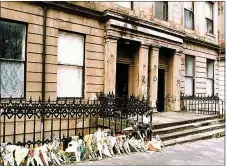  ??  ?? „ The fire broke out in Glasgow flat, which had metal bars on windows.