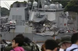  ?? EUGENE HOSHIKO, THE ASSOCIATED PRESS ?? Journalist­s observe the damaged USS Fitzgerald at the U.S. naval base in Yokosuka, southwest of Tokyo Sunday.