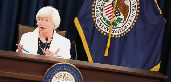  ?? — Reuters ?? Back to normalcy: Yellen speaks during a news conference after the FOMC meeting in Washington. If Trump does not replace her by year-end, then the US financial environmen­t will start its trek back to normalcy.