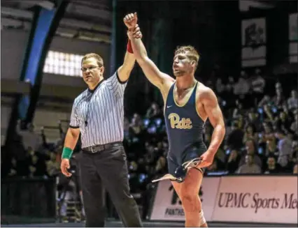  ?? COURTESY UNIVERSITY OF PITTSBURGH ATHLETICS ?? Gregg Harvey (Boyertown) has his arm raised after a victory against Oklahoma.