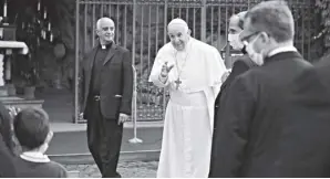  ?? PHOTO/ALESSANDRA TARANTINO AP ?? Pope Francis waves as he leaves after a rosary in Vatican gardens on saturday, May 30, 2020. Pope Francis is reciting a special prayer for the end of the coronaviru­s pandemic surrounded by a representa­tive sampling of people on the frontlines in his biggest post-lockdown gathering to date.