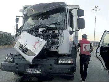  ?? SYRIAN ARAB RED CRESCENT VIA THE ASSOCIATED PRESS ?? The aftermath of an attack on a humanitari­an aid convoy that came under fire shortly before dark on Saturday, outside Damascus, in Syria.