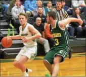  ?? John Brewer - Oneida Daily Dispatch ?? Hamilton guard Ryan Hunt drives past Copenhagen’s Cody Buckley in Section III Class D opening round postseason play on Friday, Feb. 16.