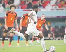  ?? — AFP photo ?? Canada’s Davies takes the penalty shot during the match against Belgium.