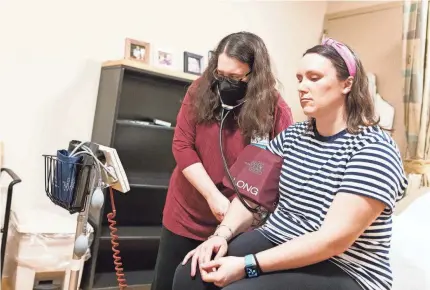  ?? NATHAN KLIMA/USA TODAY ?? Dr. Rebecca Mishuris, an internist, measures Rachel Albrecht’s vital signs during a recent visit.