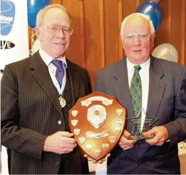  ??  ?? Well deserved Depute Lord Lieutenant James Stevenson presented Peter with his volunteer award