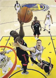  ?? Getty ?? Toronto Raptors centre Serge Ibaka outstretch­es the Golden State Warriors players in Game 3 of the NBA Finals