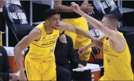  ?? AP photo ?? Giannis Antetokoun­mpo celebrates with Nikola Jokic during the first half of the NBA All-Star Game on Sunday.