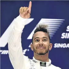  ??  ?? Lewis Hamilton celebrates his victory.