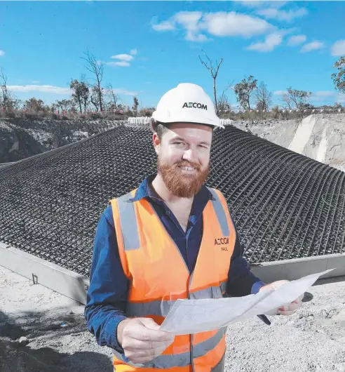  ?? Pictures: JUSTIN BRIERTY ?? ON TRACK: Paul McDonald, site representa­tive for Mt Emerald Wind Farm, checks over constructi­on work for the first turbines being built at Mt Emerald, near Walkamin, where the concrete pour is imminent.