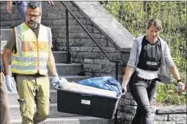  ?? MATTHIAS SCHRADER / ASSOCIATED PRESS ?? Police officers leave a former hotel Monday where a Syrian man who blew himself up Sunday night in Ansbach had lived. In a cellphone video, the 27-year-old man pledged allegiance to Islamic State.