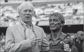  ?? ALEX BRANDON/AP FILE PHOTO ?? Former Washington Redskins general manager Bobby Beathard poses with his Hall of Fame trophy during halftime of an NFL football game between the Houston Texans and Washington on Nov. 18, 2018, in Landover, Md. The four-time Super Bowl-winning executive died Jan. 30. He was 86.