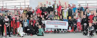  ?? PHOTO COURTESY OF LISA BLACK ?? Racers from the Waterloo Regional Kart Club with a signed banner in support of former club member Robert Wickens, who was injured in an IndyCar crash Aug. 19 and is expected to begin rehabilita­tion soon.