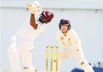  ?? Media/Athelstan Bellamy) (CWI ?? England Lions wicketkeep­er Alex Davies watches West Indies A batsman Jahmar Hamilton play a lofted drive during his sixth first-class hundred of an even 100 on the second day of the second “Test” at Sabina Park yesterday.