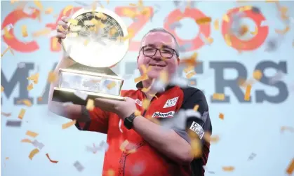  ?? ?? ‘I’m a champion now’: Stephen Bunting with the Masters trophy after his triumph in Milton Keynes. Photograph: Rob Newell/CameraSpor­t/Getty Images