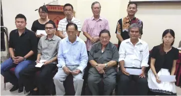  ??  ?? Lau (seated third let), Wong (seated third right) and other pro committee of Sarawak Chapter for Malaysia Budget Hotel Associatio­n (MyBHA) pose in a photo-call.