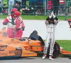  ?? AFP ?? Fernando Alonso exits after his car engine blew during the 101st Indianapol­is 500 at Indianapol­is Motorspeed­way.