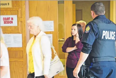  ?? ERIN POTTIE/CAPE BRETON POST ?? Deanna Marie Jessome, right, walks out of a Sydney courtroom with her grandparen­ts after hearing that convicted murderer, Thomas Ted Barrett, will not stand trial in the 2012 death of her sister, Laura Jessome.