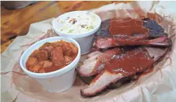  ?? PHOTOS BY DOMINIC ARMATO/THE REPUBLIC ?? Barbecue ribs and brisket with sides at Bryan's Black Mountain Barbecue in Cave Creek.