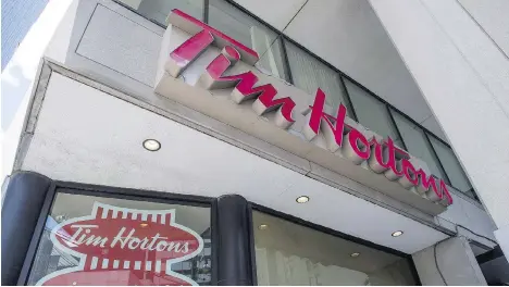  ?? EDUARDO LIMA/THE CANADIAN PRESS FILES ?? Tim Hortons’ parent company says the chain will soon expand into the Philippine­s and the U.K.