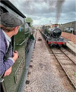  ?? TOM CLARKE/SVR ?? Severn Valley Railway-based GWR 2-8-0 No. 2857 passes mogul No. 9351 during its recent visit to the West Somerset Railway.