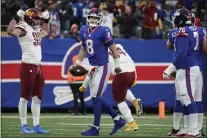  ?? JOHN MINCHILLO — THE ASSOCIATED PRESS ?? Giants quarterbac­k Daniel Jones reacts during overtime of an NFL game against the Washington Commanders on Sunday at MetLife Stadium in East Rutherford.