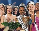  ?? PARAS GRIFFIN/ GETTY IMAGES ?? Miss Universe 2019 Zozibini Tunzi, of South Africa, is crowned onstage at the 2019 Miss Universe Pageant at Tyler Perry Studios in Atlanta.