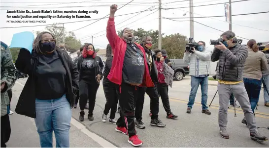  ?? PAT NABONG/SUN-TIMES PHOTOS ?? Jacob Blake Sr., Jacob Blake’s father, marches during a rally for racial justice and equality on Saturday in Evanston.