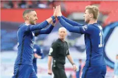  ?? — Reuters ?? Chelsea’s Hakim Ziyech celebrates scoring their first goal with Timo Werner.