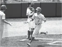  ?? Eric Gay/Associated Press ?? ■ Texas infielder Kody Clemens (2) crosses the plate after hitting a home run against Tennessee Tech in the third inning of an NCAA college super regional baseball game Sunday in Austin.