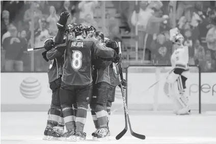  ?? CHRIS SCHNEIDER/ THE ASSOCIATED PRESS ?? The Colorado Avalanche celebrate the game- winning goal by defenceman Jan Hejda in the third period against the Vancouver Canucks Saturday in Denver. The Avalanche won 4- 3.