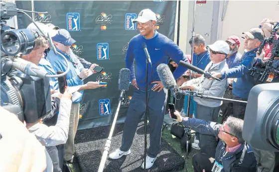  ??  ?? Tiger Woods is interviewe­d after his first round at the Arnold Palmer Invitation­al.