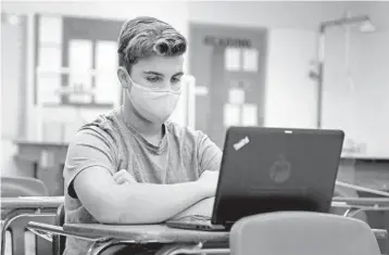  ?? SUSAN STOCKER/SOUTH FLORIDASUN SENTINEL ?? Dylan Soldini, a ninth grader at South Broward High School, attends his marine technology class on Oct. 15 in Hollywood.