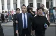  ?? THE ASSOCIATED PRESS ?? Ng Lap Seng, center, leaves federal court with his wife, right, Friday in New York.