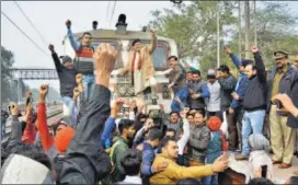  ?? PTI ?? A gang of Rajputs stop a train in Mathura on Wednesday.