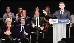  ??  ?? BORDEAUX: Former French president and candidate for the right-wing Les Republicai­ns (LR) party primaries ahead of the 2017 presidenti­al election, Nicolas Sarkozy speaks as (front row, 2L) Former French minister and Mayor of Troyes Francois Baroin...