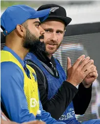  ?? PHOTOSPORT ?? New Zealand captain Kane Williamson chats with Indian skipper Virat Kohli when both sat out the final Twenty20 internatio­nal on Sunday. Williamson will again be watching on from the sidelines when the 50-over series starts today.