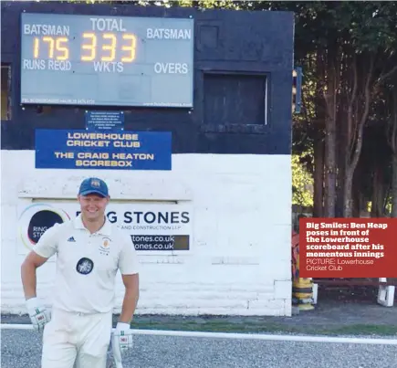  ?? PICTURE: Lowerhouse Cricket Club ?? Big Smiles: Ben Heap poses in front of the Lowerhouse scoreboard after his momentous innings