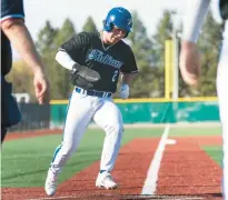  ?? KYLE TELECHAN/POST-TRIBUNE ?? Santana crosses home plate against Valparaiso on April 11.