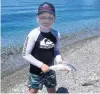  ?? PHOTO: SUPPLIED ?? Proud angler . . . Connor Hibbs (8), of Invercargi­ll, holds a landlocked salmon he caught with his father in Lake Hawea, during the Christmas holidays.