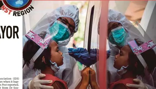  ?? AFP PIC ?? A child undergoing a swab test for Covid-19 in Surabaya, East Java, on Monday.