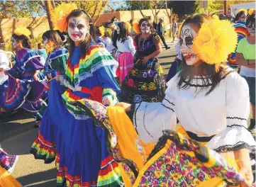  ?? ADOLPHE PIERRE-LOUIS/JOURNAL ?? Ernie Pyle Middle School students dance during the Día de los Muertos Marigold Parade in November 2012. Organizers of the parade have announced that the 2019 event will not be held because it is now too large.