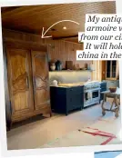  ??  ?? My antique French armoire was moved from our city bedroom. It will hold all of our china in the new kitchen
