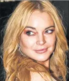  ??  ?? LO’ BLOW: Lindsay Lohan (above) claims this “Grand Theft Auto V” character is a likeness of her that was used without her permission.