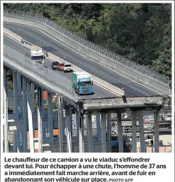  ?? PHOTO AFP ?? Le chauffeur de ce camion a vu le viaduc s’effondrer devant lui. Pour échapper à une chute, l’homme de 37 ans a immédiatem­ent fait marche arrière, avant de fuir en abandonnan­t son véhicule sur place.