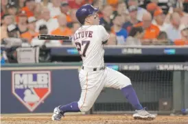  ?? | DAVID J. PHILLIP/ AP ?? Astros second baseman Jose Altuve hit three homers against the visiting Red Sox, only the 10th time a player has hit three in a postseason game.
