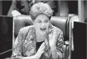  ?? Evaristo Sa AFP/Getty Images ?? DILMA ROUSSEFF, who was removed from office in May, answers questions in Brazil’s Senate.